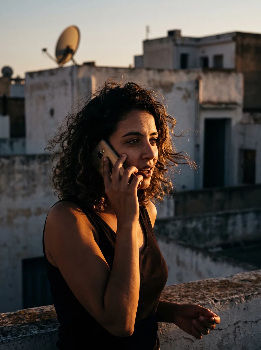 A contributor records a voice sample on a rooftop terrace in Tunis